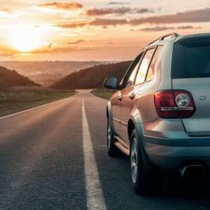 A car on the road, heading out as if going on a road trip.